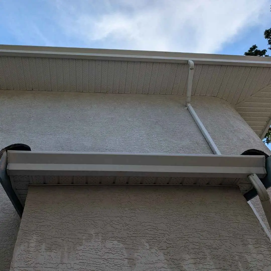 A clean gutter free of debris after professional cleaning, ensuring proper drainage and home protection.