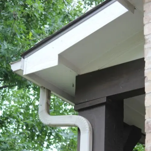 Improperly sloped gutters causing water to pool and potentially damage the roof.